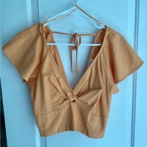 Vestique crop shirt, size Small, never worn with tag still on.